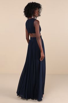 Even your wildest dreams can come true in the Lulus Vivid Imagination Navy Blue Cutout Maxi Dress! Pleated chiffon sweeps into a plunging V-neckline and fitted bodice, while a crisscrossing waist transitions into sexy side cutouts that wrap the back. Full, flowing maxi skirt completes the look. Hidden back zipper/clasp at the top and at the skirt. Fit: This garment fits true to size. Length: Floor length. Size medium measures 61" from shoulder to hem. Bust: Works best for A to C cup sizes - cons Cutout Dress Formal, Prom Dress Shops, Dress Shops, Cutout Maxi Dress, Dress Pleated, Pleated Chiffon, Maxi Dress Prom, Prom Dress Shopping, Wildest Dreams