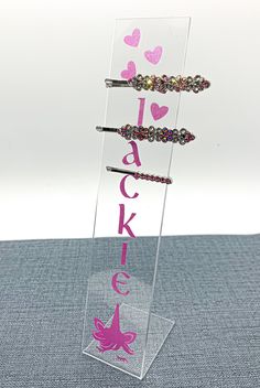 "Organize all those hair clips on this personalized acrylic hair clip holder! Add a set of pigtail hair bows to make an awesome gift! Fits every hair clip size. Clip holder measures 7.5x1.5\" and can be custom personalized in any color and design you want! Stunning gift wrapping is available at checkout. Clips that are on the clip holder in the pictures are 2\"clips. Additional larger size will be available at the end of February 2022. Please message me if you would like to personalize in specif Hair Clip Storage, Girls Gift Idea, Hair Clip Organizer, Clip Organizer, Clip Storage, Pigtail Hair Bows, Hair Clip Holder, Alligator Hair Clip, Diy Jewelry Display