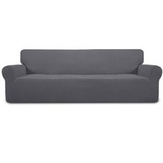 a gray couch sitting on top of a white floor