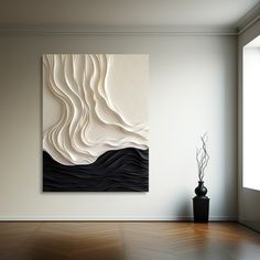 an abstract painting hangs on the wall next to a vase with a plant in it