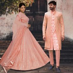 Menswear:- Faux Georgette Sherwani in Peach. This Readymade attire with Satin Lining is Enhanced With Fancy Buttons, Pockets, Stone Studded Brooch, Resham and Sequins Work. Crafted in Chinese Collar Neck and Full Sleeve Available with an Art Silk Pant in Peach and an Art Silk Inner Front Open Kurta in Peach Do note: Footwear shown in the image is for presentation purposes only. Half to one inch may vary in measurement. (Slight variation in actual color vs. image is possible) Lehenga Choli:- Faux Sherwani And Lehenga Combo, Embroidered Anarkali Sherwani For Reception, Festive Wedding Sets With Chikankari Embroidery, Fitted Embroidered Sets For Reception, Fitted Pink Sherwani With Pallu, Bollywood Wedding Sets With Chikankari Embroidery, Festive Reception Sets With Chikankari Embroidery, Pink Fitted Bollywood Sherwani, Fitted Anarkali Sherwani With Resham Embroidery