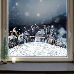 a christmas scene is drawn on a window sill in front of the night sky