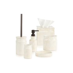 bathroom accessories including soap dispenser, toothbrush holder and toilet paper roll