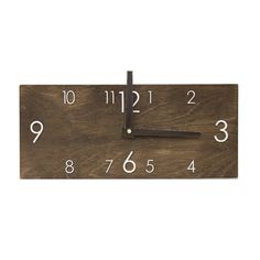 a wooden clock with white numbers on it