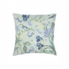 a blue and green pillow with flowers, butterflies and dragonflies on the front side