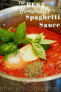 the best homemade spaghetti sauce with basil leaves and parmesan cheese in a pot