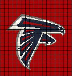 the atlanta football team logo on a red and black plaid pattern with white trims