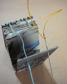 an origami model with scissors and thread