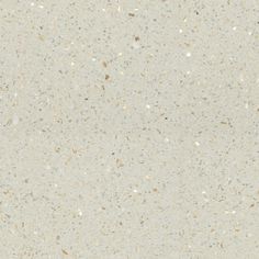 a white counter top with lots of speckles on it