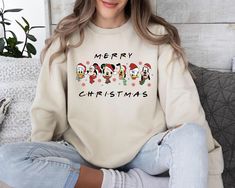 Mickey And Friends Christmas Sweatshirt, Christmas Sweater, Christmas Mickey Sweater, Christmas Party, Holiday Season, Christmas Gift Welcome to our store where you can find beautiful sweaters specially prepared for you. Make yourself and your loved ones happy with these special sweaters. Product details: *Collar, shoulders, armholes, cuffs and bottom hem are double stitched. *1 x 1 rib contains spandex for flexibility. *Collar type: Crewneck *Relaxed fit - Unisex *50% cotton 50% polyester blend Mickey And Friends Christmas, Christmas Mickey, Mickey Mouse Christmas, Friends Christmas, Disney Sweaters, Looking Forward To Seeing You, Friend Christmas, Sweatshirt Christmas, Beautiful Sweater