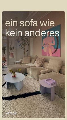 a living room filled with furniture and a painting on the wall above it that reads,'een sofa wie kein anderes