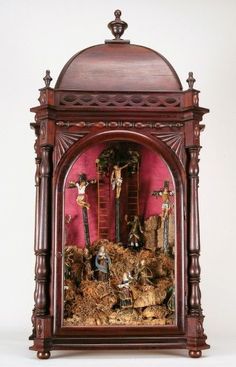 an ornate wooden clock with crucifixs on it