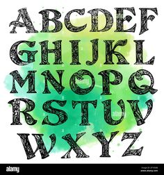 an old english alphabet written in black ink on a green watercolor background - stock image