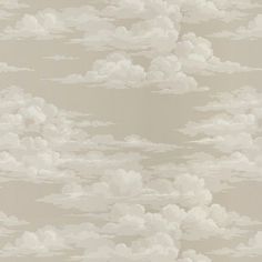 an image of clouds in the sky on a beige wallpaper background with neutral tones