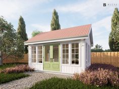 a small white shed with green doors and windows