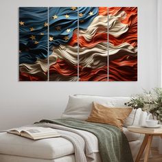 a living room with white couches and three paintings on the wall, one has an american flag painted on it