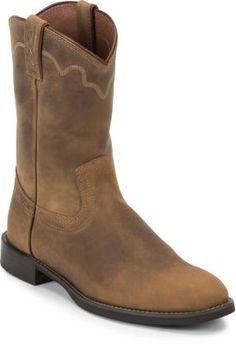 The Jeb Tan Apache is a 10" tall Men's Stampede roper boot built for comfort and utility. This classic cowboy boot has a rugged golden brown leather exterior that has a slightly lived-in look. Its rounded toe and unit heel provide an easy fit and the J-Flex Flexible Comfort System insoles with removable orthotic inserts guarantee comfort. This boot also features the Justin Stabilization Technology that uses dual density medical memory foam to stabilize the foot while still allowing for freedom o Justin Boots Boot Barn, Justin Cowboy Boots, Mens Cowboy Boots Square Toe Brown, Vaquera Boots Caballobronco.com, Classic Cowboy, Roper Boots, Boot Companies, Justin Boots, Tractor Supply