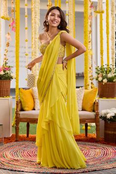 Sunshine yellow pre-draped saree with embroidered border. Paired with glass bead, sequin, cutdana embroidered blouse. - Aza Fashions Sari For Haldi Function, Pre Draped Saree Designs, Pre Draped Saree Indian Weddings, Haldi Outfit For Bride Saree, Yellow Sari For Haldi Function, Yellow Saree For Haldi Bride, Haldi Saree Look For Bride, Haldi Function Outfit Ideas, Haldi Saree Outfit