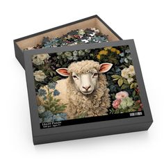 a puzzle box with a painting of a sheep surrounded by flowers and leaves on it