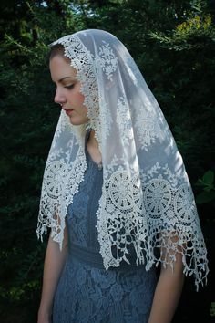 "Evintage Veils~ In an incredibly intricate, beautiful embroidered lace, this soft, ivory veil is of heirloom quality. A medium length mantilla, it provides excellent coverage, and it is soft and comfortable. Measures about 50 X 23 inches. In a long size, here: https://www.etsy.com/listing/1056055539/evintage-veils-mater-dei-heirloom-wrap?ref=shop_home_active_1 Also in an infinity veil here: https://www.etsy.com/listing/960466585/evintage-veilsready-to-ship-mater-dei?ref=shop_home_active_41& Vintage Lace With Lace Trim For Ceremony, Cream Embroidered Lace For Ceremony, Ceremony Embroidered Cream Lace, Cream Lace Veil With Lace Work, Bohemian Cream Crochet Lace, Vintage Embroidered Lace For Wedding, Cream Bohemian Lace With Lace Trim, Bohemian Cream Lace With Lace Trim, Vintage Cream Lace For Ceremonies