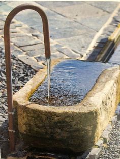 a water fountain that is sitting in the street