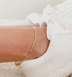 Dazzle and sparkle everywhere you go with this Gold Anklet. Show off your confidence and fashion-forward style with this shining gold ankle bracelet. Perfect for any occasion, this waterproof anklet is perfect for summer. Metal: 18k Gold FilledSize: 2mm wide, 9 inches long with 2 inches extender Hypoallergenic AnkletsWaterproof Anklets Trendy Gold Anklet With Adjustable Chain, Adjustable Gold Trendy Anklets, Gold Bracelet With Delicate Chain For Summer, Gold Delicate Chain Bracelet For Summer, Gold Bracelet For Summer, Delicate Gold Chain Bracelet For Summer, Gold Bracelets For Summer, Gold Anklets For Everyday Summer Wear, Minimalist Gold Anklets For Summer