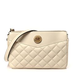 This is an authenticVERSACE Nappa Quilted La Medusa Shoulder Bag in Off White. This luxurious shoulder bag is crafted of grained calfskin leather. The bag features a chain shoulder strap, polished gold hardware, and a prominent gold medusa head on the front. The top zipper opens to a black fabric interior with a patch pocket. Luxury Cream Shoulder Bag With Chain Strap, Cream Leather Shoulder Bag With Chain Strap, Cream Leather Bag With Chain Strap, Cream Calf Leather Shoulder Bag For Evening, Evening Cream Calf Leather Shoulder Bag, Medusa Head, Chain Crossbody Bag, Black Cross Body Bag, Pink Bag