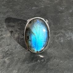 large oval labradorite ring  Metal - 925 sterling silver  Hardness - 6 - 6.5  Origin - Madagascar  Weight - 16.4 grams  Ring Size -  U.K. - N U.S. - 7 EU - 14 / 54 Dimension -  L 2.95 x B 2.09 x H 0.99 cm  L 1.16 x B 0.82 x H 0.39 inch  Band width - 2.6 - 0.84 cm Healing properties- Intuition, Insight, Success, Protection, Healers of relationship  Birthstone - Aquarius Oval Labradorite Gemstone Ring, Labradorite Gemstone Oval Ring, Oval Labradorite Ring With Natural Stones, Moonstone Ring With Oval Labradorite, Oval Labradorite Ring Stamped 925, Big Band, Labradorite Ring, Healing Properties, Metal Rings