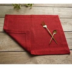 a red napkin with two forks on it