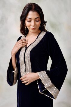 Amp up your look with the grace and simplicity of this New Navy blue velvet suit with overall embroidery. Having a lightweight dupatta and an easy-to-style appeal, this lehnga is an excellent pick for days when you are looking for sheer perfection.StyleNavy blue velvet suitEmbroidered DetailingMatching DupattaChiffon fabricSpecificationsModel height - 5'7"Model wearing - S Eid Velvet Sharara, Eid Velvet Semi-stitched Sharara, Wedding Velvet Long Sleeve Sharara, Wedding Long Sleeve Velvet Sharara, Designer Velvet Palazzo Set With Dabka Work, Velvet Palazzo Set With Dabka Work For Designer Wear, Velvet Sharara With Resham Embroidery For Eid, Embroidered Velvet Sharara For Party, Velvet Palazzo Set With Dupatta