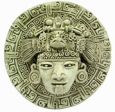 an ancient head is shown in the center of a circle with intricate designs on it