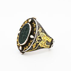 Central Asian Seljuk Style Afghan Turkmen Silver Ring with Gold Gilding and Sasanian Style Intaglio Seal The Sälçük (Seljuk) Dynasty (Türki: سَلجُك; Farsi: سلجوق) was a dynasty of Oğuz (Oghuz) Türkmän (Turkmen) origin, founded by members of the Qınıq sub-tribe in the Early Middle Ages. Persian jewelry revolutionized under their rule and many molds, particularly those for rings, were passed down to modern Afğani (Afghan) and Türkmen artisans, who used them to recast these rings in silver with gold or brass gilding. Essentially, these rings are typically vintage reproductions of medieval Sälçük pieces. However, there are also cases where these Afğani and Türkmen artisans developed their own derivative styles, mixing elements of original Sälçük jewelry. The two types of jewelry can be dif Traditional Carved Yellow Gold Rings, Traditional Engraved White Gold Signet Ring, Traditional Carved Ceremonial Rings, Oval Ceremonial Carved Jewelry, Traditional Carved Rings For Ceremonial Occasions, Traditional Hallmarked White Gold Signet Ring, Traditional Ceremonial Intaglio Jewelry, Antique Ceremonial Intaglio Jewelry, Antique Intaglio Ceremonial Jewelry