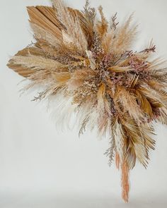 a bunch of dried flowers sitting on top of a table