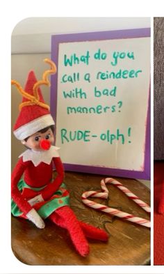 an elf sitting on top of a wooden table next to a sign that says, what do you call a reindeer with bad maners? rude - oh