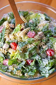 a salad with pasta, meat and vegetables in it