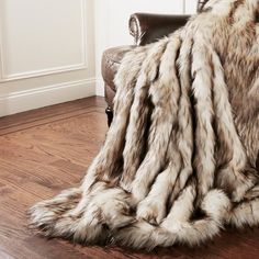 a chair with a furry blanket on top of it