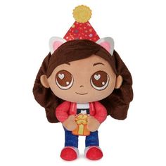 a small stuffed animal with a party hat on it's head and brown hair