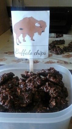 chocolate cookies in a plastic container with a sign that says buffalo chips on the side