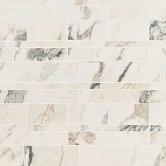 a white marble tile wall that looks like it is made out of tiles