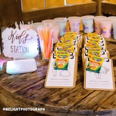 there are many cups on the table with some candy in them, and one is for sale