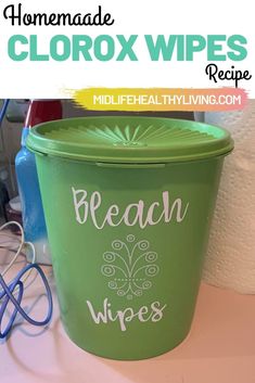 a green trash can with the words beach wipes written on it in white lettering