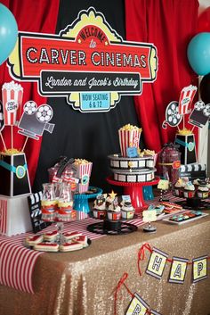 a carnival themed birthday party with popcorn, cake and candy buffets on the table