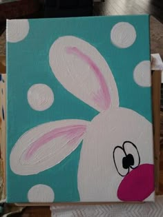 a painting of a rabbit with polka dots on it