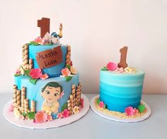 two cakes decorated with cartoon characters on top of each other, one blue and the other pink