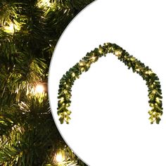 an ornament hanging from a christmas tree with green leaves and lights on it