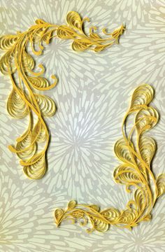 the letter c is made up of gold leaves and swirls on a white background