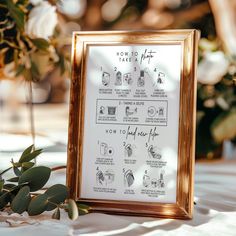 a framed poster with instructions for how to tie the knot on it next to some flowers