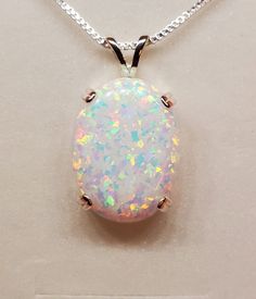 "Large White Lab Created Opal 15x20mm Full Of Rainbow Fire-See Video! There Is More Pink Than Photos Show. Sleek 925 Sterling Silver Pendant With Choice Of Setting Styles, Split Bail, OR Single Dangle (Choose In Drowndown)18\" Sterling Chain. Chain Length Options Available By Messaging Seller At Time Of Purchase. Message Seller For Availability. Great Gift! Gift Box Included * I Have An Even Larger One Too! https://www.etsy.com/Cloudrivercreations/listing/1303871722/huge-white-opal-necklace-18x25mm" Opal Jewelry Necklace, Rainbow Fire, Hand Necklace, White Lab, Pinterest Ideas, Necklace Making, Pretty Jewelry, Silver Jewelry Pendant, Opal Necklace