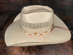 "All bead work is beaded with 10lb extreme braided nylon line. All hat bands are finished at 23\" with glued than sewed down leather ends and an adjustable leather tie." Western Style Woven Brown Hat Band, Brown Woven Western Hat Band, Brown Woven Country Hat Band, Country Style Woven Hat Band For Rodeo, Western Braided Hat Band For Ranch, Artisan Adjustable Hat Bands For Outdoor, Aztec Hat, Steer Head, American Flag Hat