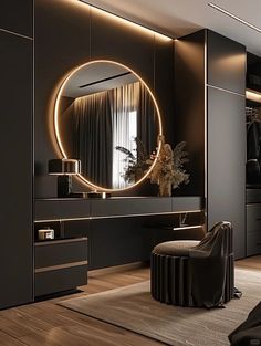 a modern dressing room with black furniture and round mirror